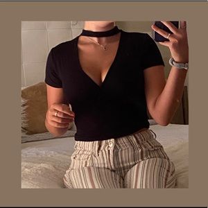 SOLD       black wrap top bodysuit !